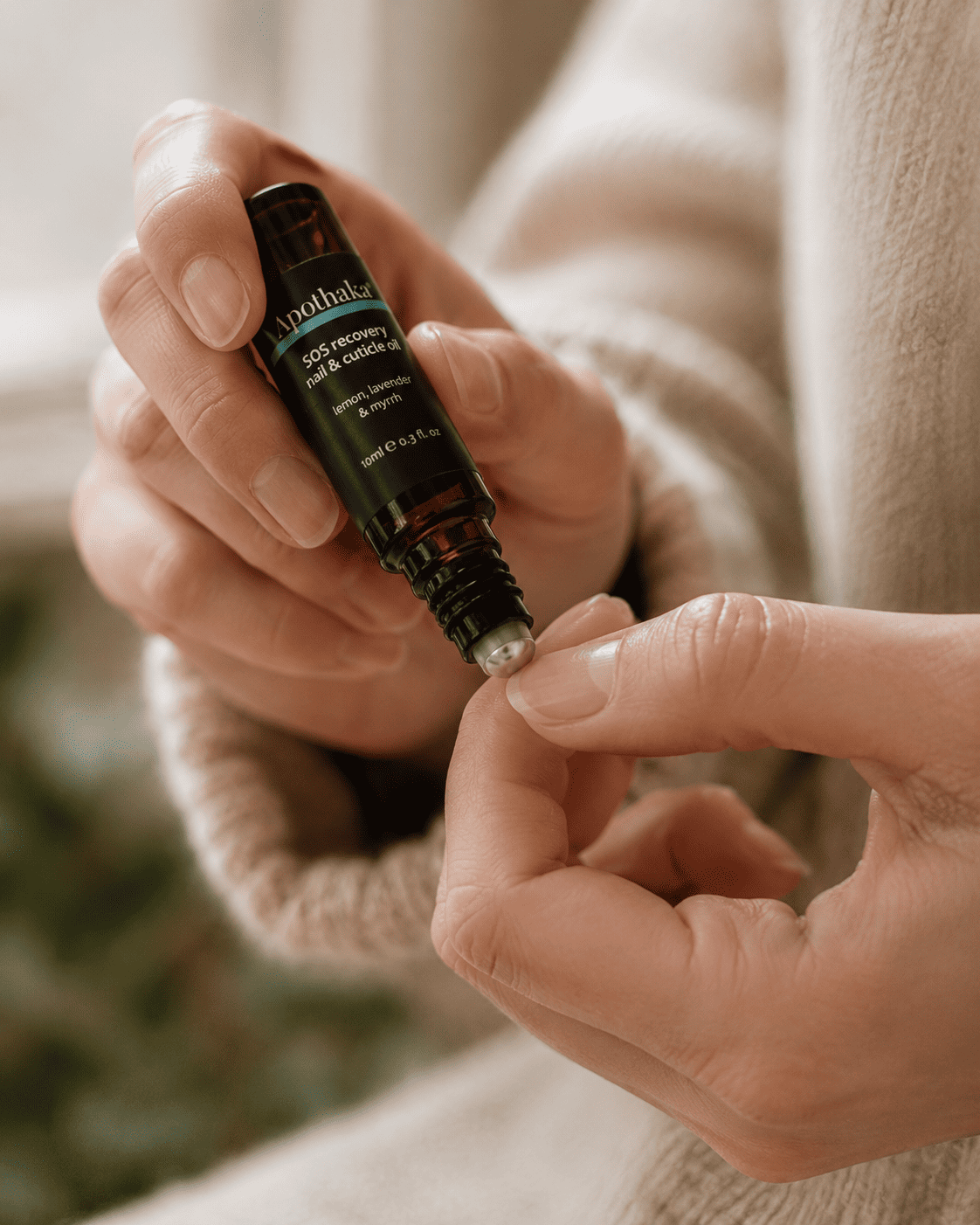 Rollerball nail oil in use — lifestyle AI photography with real skin